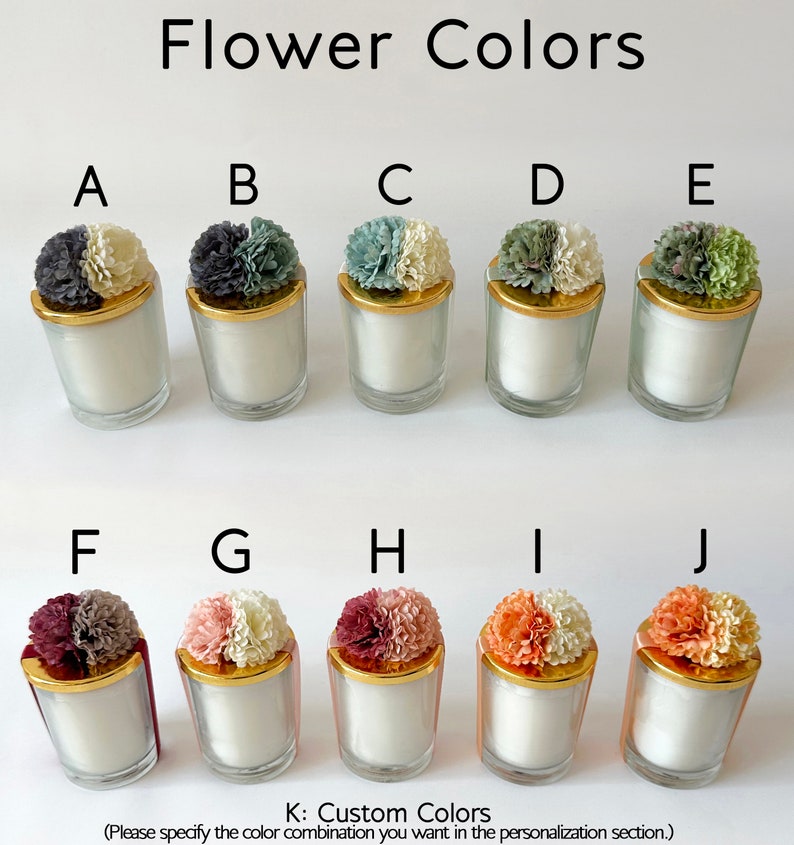 May include: Ten small glass candle jars with gold lids and different coloured flower tops. The flower colours are: A - white and grey, B - grey and white, C - green and white, D - white and green, E - green and white, F - burgundy and grey, G - pink and white, H - burgundy and white, I - orange and white, J - orange and white. The text below the jars reads: "K: Custom Colours (Please specify the colour combination you want in the personalisation section.)"