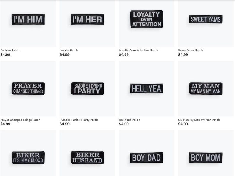 May include: Collection of black and white embroidered patches with various phrases, including "I'm Him," "I'm Her," and "Sweet Yams." These patches are rectangular and designed for clothing or accessories.