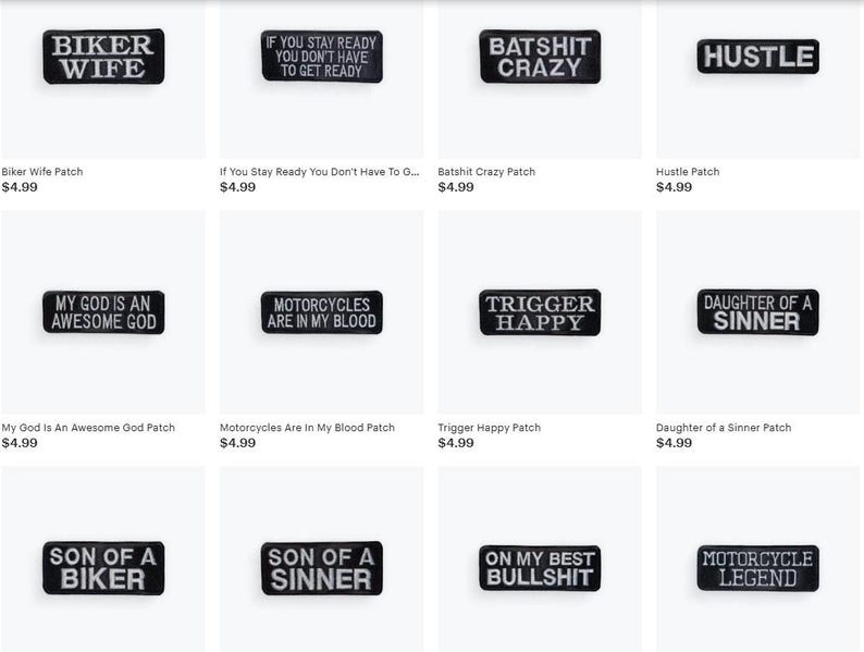May include: A collection of black rectangular patches with white text. The patches feature phrases like "BIKER WIFE," "HUSTLE," and "TRIGGER HAPPY." These patches are likely designed for jackets or other apparel, and are a biker-themed accessory.