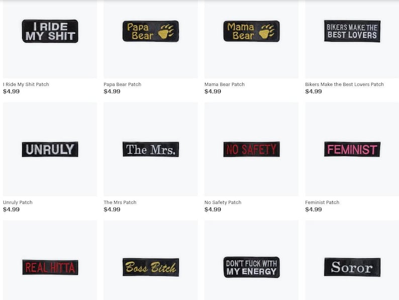 May include: Collection of black rectangular patches with white or gold text. Phrases include "I Ride My Shit," "Papa Bear," "Mama Bear," "Bikers Make the Best Lovers," "Unruly," "The Mrs.," "No Safety," "Feminist," "Real Hitta," "Boss Bitch," "Don't Fuck With My Energy," and "Soror."