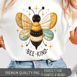 May include: White t-shirt featuring a colorful bee design with the text "BEE KIND". The bee has yellow, black, and blue wings with a patchwork pattern. The shirt also includes the text "PREMIUM QUALITY PNG" and "PERFECT FOR T-SHIRTS & MORE!"