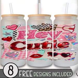May include: Three glass tumblers with bamboo lids and straws. Each tumbler features a design with the words "Hey Cutie" in pink glitter and red metallic lettering, along with hearts, lips, and sunglasses. The bottom left corner has the number "8".