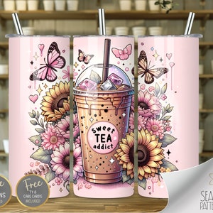 May include: A pink tumbler with a graphic of a cup of iced tea with the text "sweet tea addict" and a floral design with butterflies and sunflowers.