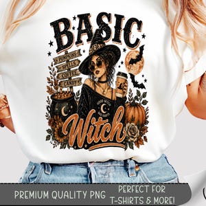 May include: A white t-shirt featuring a graphic print of a person wearing a witch hat and sunglasses, holding a coffee cup. The design includes the text BASIC WITCH, a signpost labeled PUMPKINS, SPELLS, COFFEE, CANDY, a cauldron, a pumpkin, and bats.