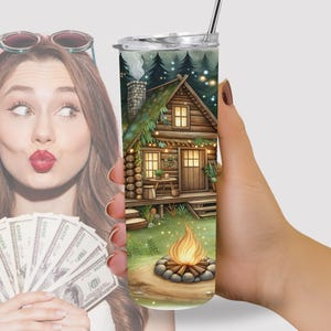 a woman holding a cup with a picture of a house on it