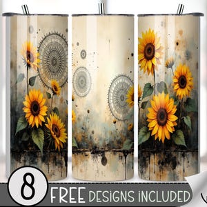 May include: A set of three stainless steel tumblers with a sunflower design. The design features bright yellow sunflowers with dark brown centers and green leaves against a beige background. The text "8 FREE DESIGNS INCLUDED" is at the bottom.