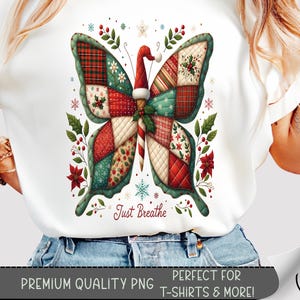 May include: White t-shirt featuring a colorful butterfly design with a Christmas theme. The butterfly has patchwork wings in red, green, and white, with a Santa hat on its head. The text "Just Breathe" is below the butterfly. The image also includes the text "PREMIUM QUALITY PNG PERFECT FOR T-SHIRTS & MORE!"