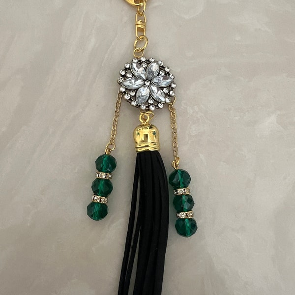 Purse charm. Add a fun and fancy decor to your purse with this rhinestone flower charm and faux suede tassel. Great gift for girls and women