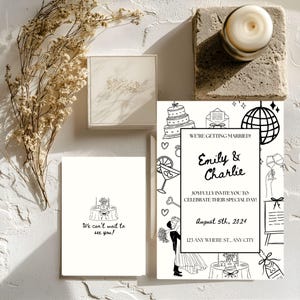 Op de afbeelding: Trouwuitnodigingsset met een zwart-wit ontwerp. De hoofdkaart bevat de tekst "We're Getting Married!" en de namen "Emily & Charlie". Extra kaarten en een kleine doos zijn ook aanwezig.