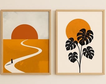 Könnte beinhalten: Zwei gerahmte Kunstdrucke. Der linke Druck zeigt eine minimalistische Landschaft mit einer sich schlängelnden weißen Straße, einer Figur und einer untergehenden Sonne in Orange- und Gelbtönen. Der rechte Druck zeigt eine schwarze Monstera-Pflanzensilhouette vor einer orangefarbenen Sonne.