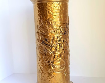 Vintage embossed brass umbrella stand featuring tavern scene