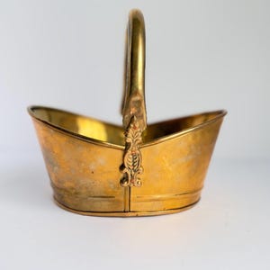 May include: A set of three ceramic mugs with a speckled, matte finish. The mugs are in shades of cream, light gray, and dark gray. Each mug has a simple, minimalist design and a rounded handle.