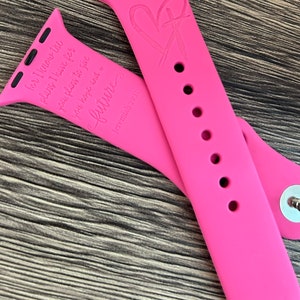 May include: Pink silicone Apple Watch band with a heart and cross design and the text "for I know the plans I have for you, plans to give you hope and a future" and "Jeremiah 29:11".