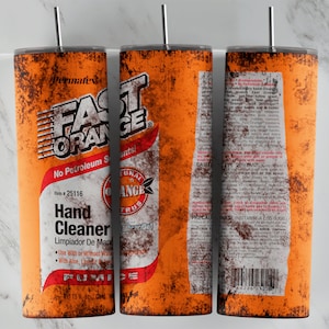 May include: A rusty orange and red can with the text "Permafex Fast Orange Hand Cleaner" and "No Petroleum Solvents!"  The can has a white label with black text and a small orange and green citrus logo. The can is 15 fl oz.