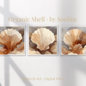 May include: A triptych of watercolor seashell art prints in white frames. The artwork features a light brown and beige seashell design against a backdrop of muted brown and gray tones. The text "Organic Shell" and "by Souline" is visible.