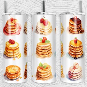 May include: Three stainless steel tumblers with a white background and images of stacks of pancakes with various toppings, including strawberries, cherries, syrup, and chocolate.