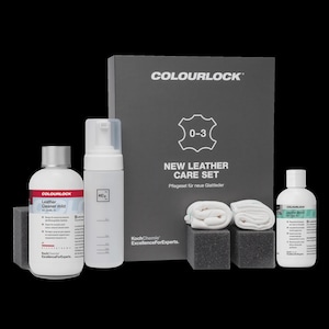 May include: A COLOURLOCK New Leather Care Set 0-3 including a bottle of Leather Cleaner mild, a translucent foaming dispenser, a bottle of Leather Shield, two white cloths, and two dark gray sponges, all presented with a dark gray box.