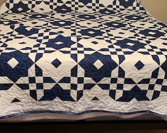 This Blue and White charming Quilt. Crisp, calm, and captivating--experience the magic of blue & white! This handmade quilt is perfect.