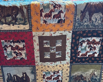 Cowboy/Horse themed 61 x 84 Full/Double Finished Quilt. This is a piced together and machine quilted home made quilt.