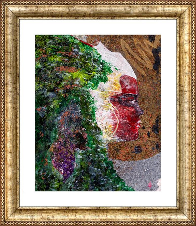 May include: Abstract art print in a gold frame. The artwork features a profile of a face in shades of red, white, and yellow, with a green and purple textured area on the left. The background is a mix of brown and gray.