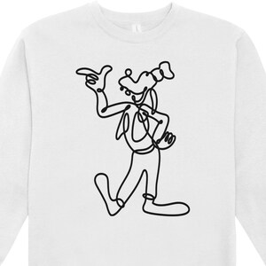 May include: White sweatshirt featuring a black line drawing of a cartoon character in a walking pose, with one arm raised and pointing. The character has a dog-like face and is wearing a hat. The sweatshirt has a crew neck and long sleeves.