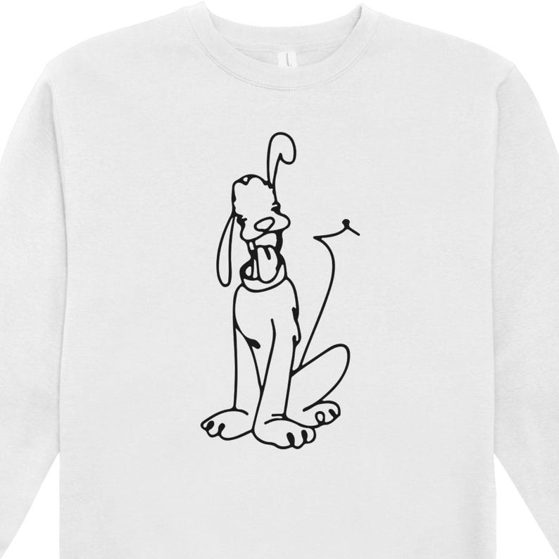May include: White sweatshirt featuring a black line drawing of a cartoon dog with its tongue out. The dog is sitting with its tail curled. The sweatshirt has a crew neck and long sleeves.