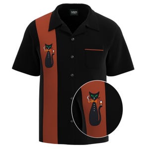 May include: A black short-sleeved bowling shirt with a red and orange stripe down the center. The shirt has a black cat with a bow tie and a glass of wine embroidered on the left side of the shirt.