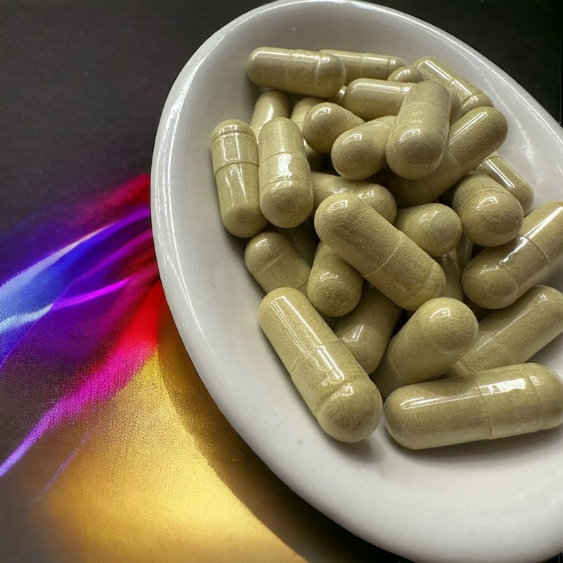 May include: A white ceramic bowl filled with a large quantity of beige capsules. The capsules are arranged in a random pattern.