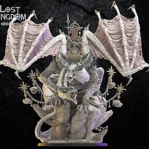 May include: A detailed, white, skeletal dragon miniature with pink wings, sitting on a rocky base. The dragon is adorned with gold chains and stars, and has a crown on its head. The miniature is part of the Lost Kingdom miniatures collection.