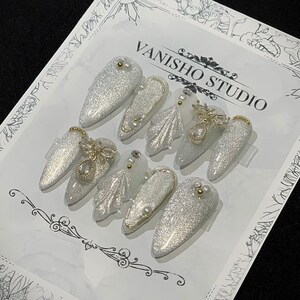 Handmade Reusable Almond Cat Eye With Shinny Golden Charms Press On Nails | Blinky Nail | White Luxury Nail | Douyin nails | Wedding | Gift