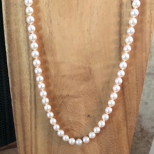 Pearl necklace, Akoya pearls.  18&quot; Akoya pearl necklace. 7.0mm diameter on silk thread.  14KY pearls clasp