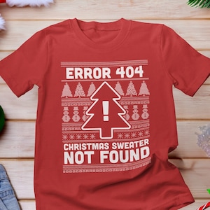May include: Red Christmas jumper with a white design that says "ERROR 404 CHRISTMAS SWEATER NOT FOUND". The design includes a Christmas tree with an exclamation point.
