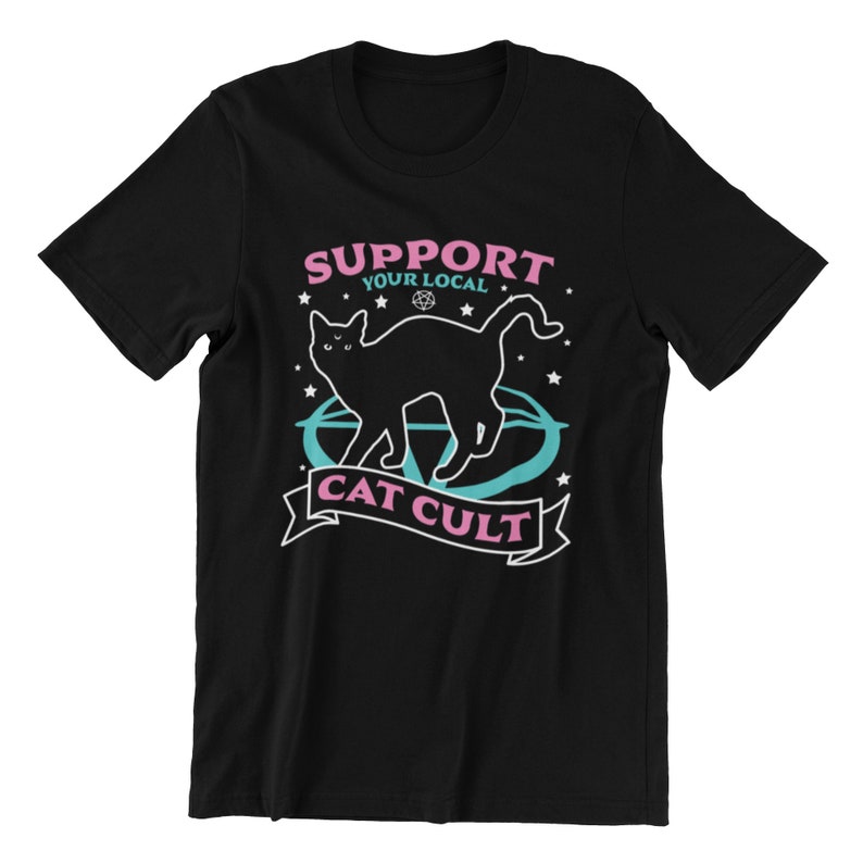 May include: Black t-shirt with a graphic of a black cat standing in a pentagram with the text "Support Your Local Cat Cult" in pink and blue.