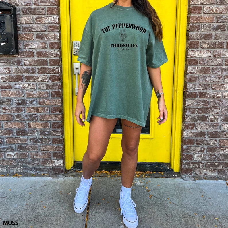 a woman standing in front of a yellow door