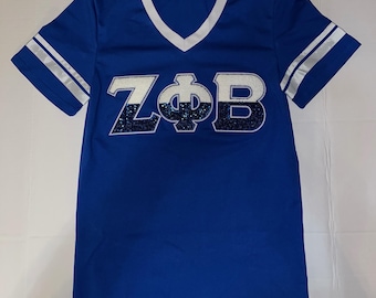 Zeta Phi Beta Royal v-hals chenille en pailletten geborduurde letters met witte strepen op mouwen