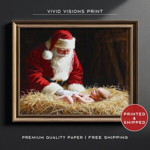 May include: A framed print depicts Santa Claus in a red suit and hat, looking down at a baby lying in hay. The artwork has a warm, inviting color palette and is set against a dark background. The text "VIVID VISIONS PRINT" is at the top.