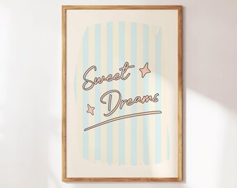 May include: A framed print with a blue and white striped background and the text "Sweet Dreams" in a pink cursive font. There are two small pink stars on the print.