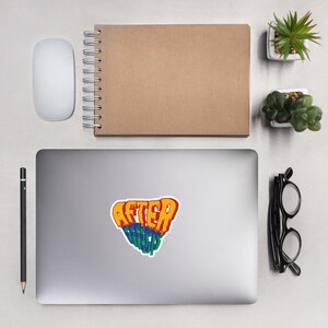 May include: A laptop computer with a sticker that says "After Effects" in a colorful, distorted font.