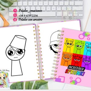 Op de afbeelding: Een roze spiraalnotitieblok met een kleurrijke illustratie van cartoonfiguren op de omslag. De figuren zijn kleurrijk en hebben grote ogen. De tekst "INCREDIBOX SPRUNKI" staat op de omslag gedrukt. Het notitieblok is open op een blanco pagina met een zwart-witte tekening van een cartoonfiguur.
