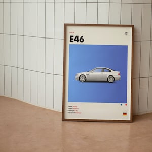 以下が含まれることがあります： 青い背景に白いBMW E46が描かれた額装されたポスター。ポスターには「BMW E46」の文字と、車の仕様が記載されています。出力: 343馬力、トルク: 269lb-ft、0-100km/h: 4.5秒、最高速度: 249km/h。