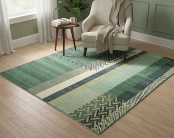 May include: A rectangular area rug with a geometric design in shades of green, cream, and blue. The rug features stripes and zigzag patterns, creating a modern and textured look. The rug is placed on a light-colored wooden floor.