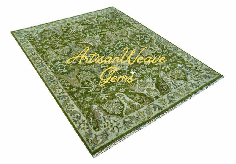 May include: A green rug with a floral pattern and a gold inscription that reads "Artisan Weave Gems".