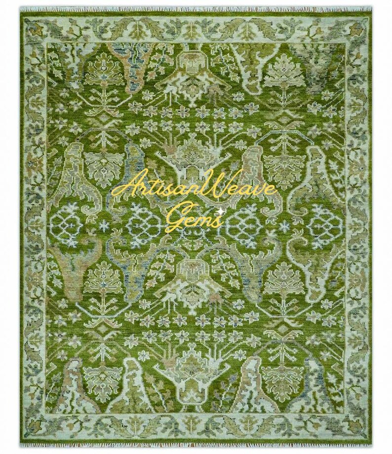 May include: A green rug with a traditional Persian design. The rug has a light green background with a darker green pattern. The pattern includes floral motifs, geometric shapes, and stylised animals. The rug has a fringed border.