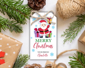 May include: A white Christmas gift tag featuring a Santa Claus illustration, snowflakes, and the words "Merry Christmas" in green and red. The tag is tied with twine and surrounded by festive decorations.