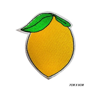 May include: Embroidered patch of a yellow lemon with green leaves and a white border. The patch measures 7cm x 8cm.