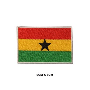 May include: An embroidered patch of the flag of Ghana. The flag is red, yellow, and green with a black star in the center. The patch is 9 cm by 6 cm.