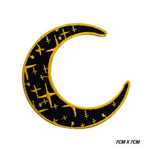 May include: Embroidered patch in the shape of a crescent moon, with a black interior and gold stars and crosses. The moon's outline is gold. The patch measures 7cm x 7cm.