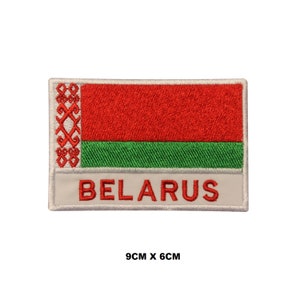 May include: Embroidered patch featuring the flag of Belarus. The patch is white with a red and green flag in the center and the word "BELARUS" in white lettering. The patch measures 9 inches by 6 inches.