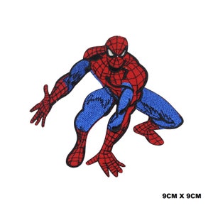 May include: Red and blue embroidered iron-on patch of Spider-Man in a crouching pose. The patch is 9 cm by 9 cm.