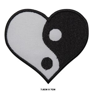 May include: Black and white yin yang symbol in a heart shape. The patch is made of embroidered fabric and measures 7.8 inches by 7 inches.